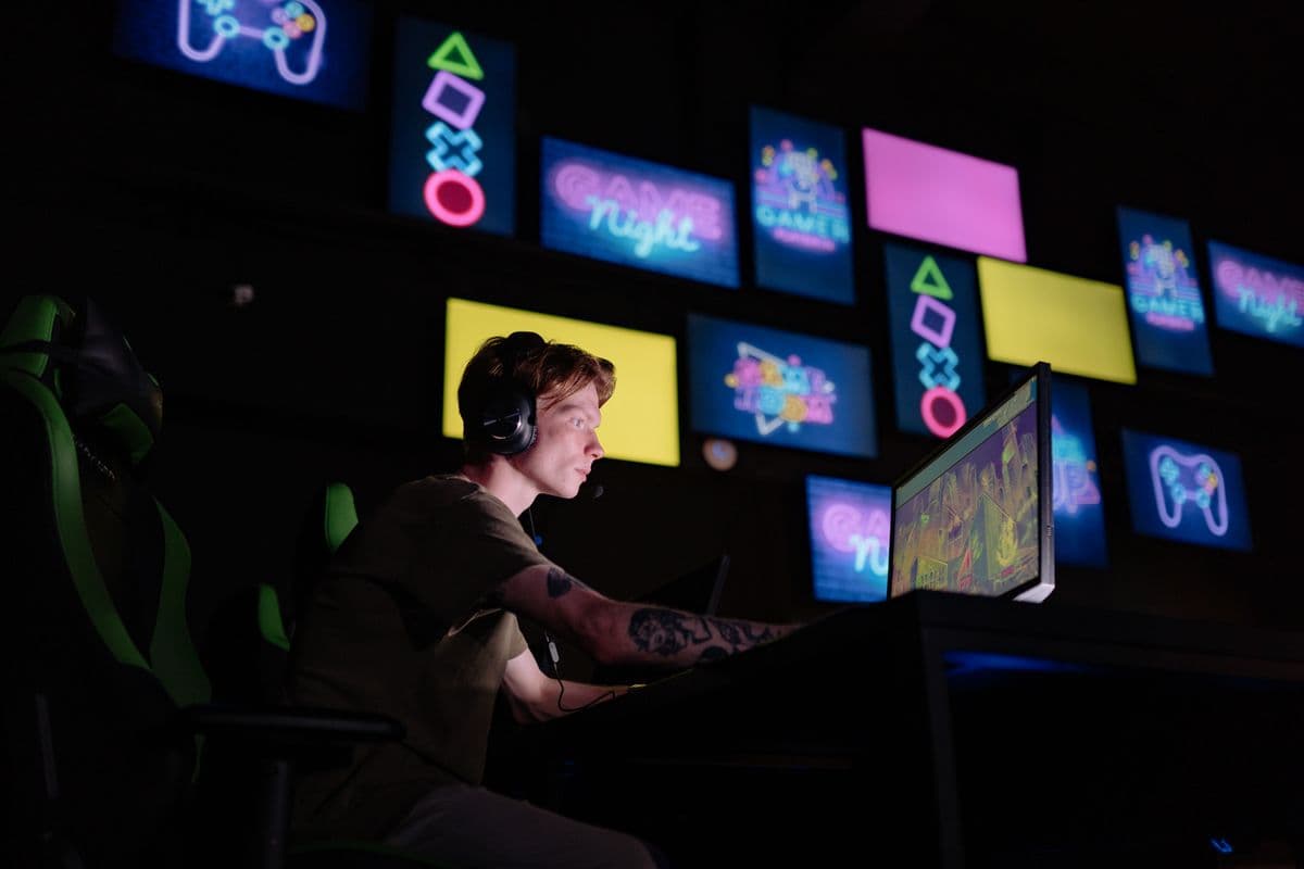 A gamer at a computer setup